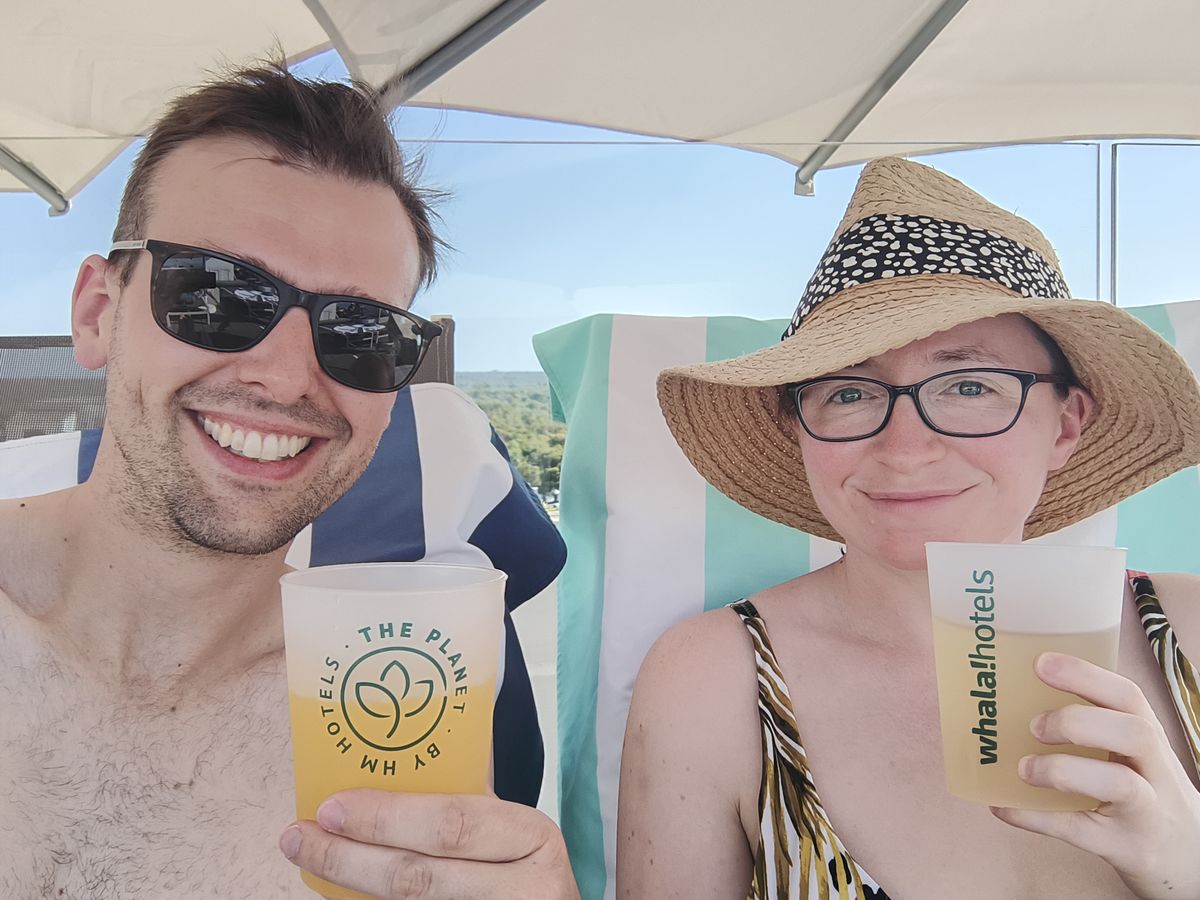 Harry and Zoe under a parasol with cold drinks on the afternoon of the eclipse.